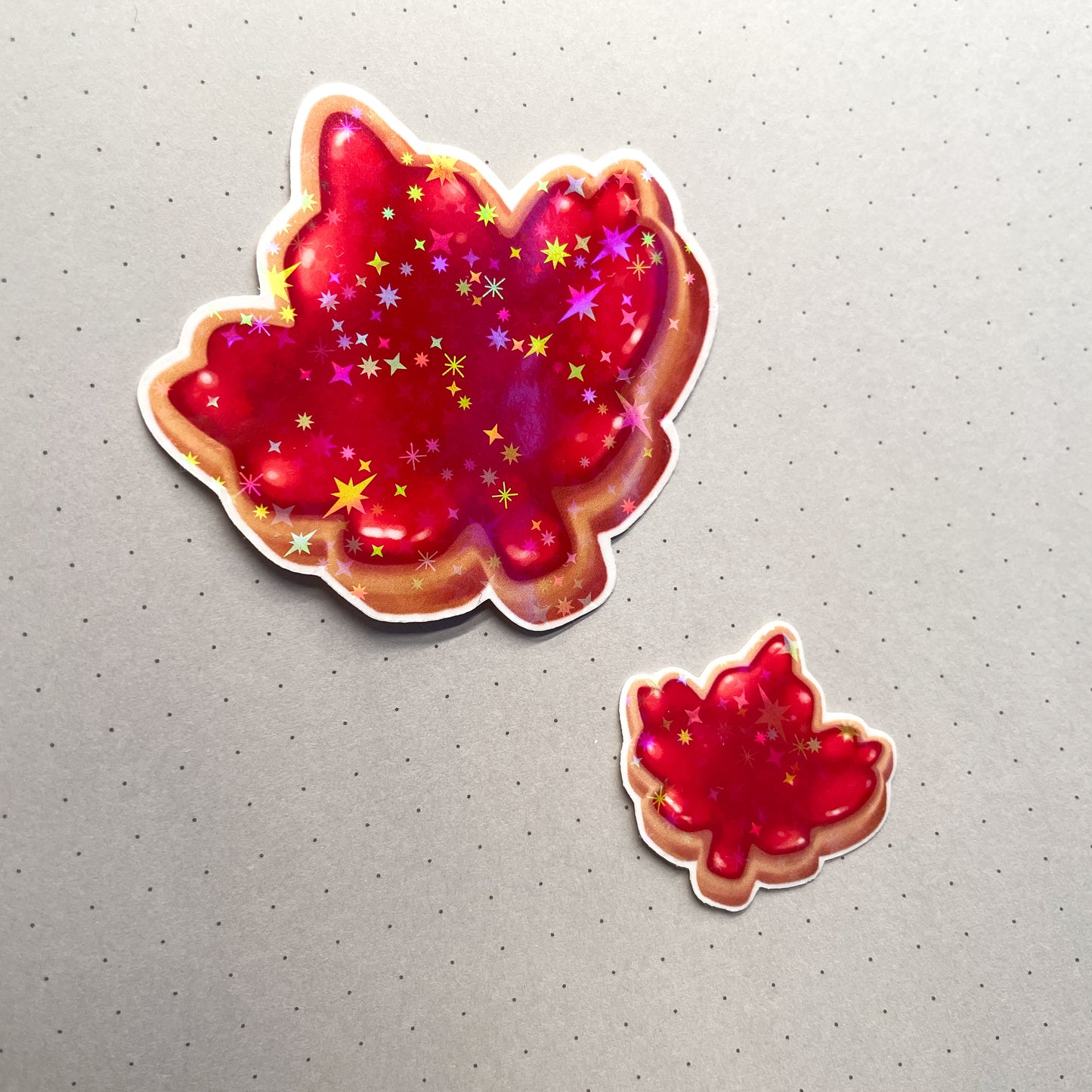Canadian Maple Leaf Cookie Sticker Set - Jammy biscuits that sparkle and shine! One large and one mini holographic sticker. Made in Canada