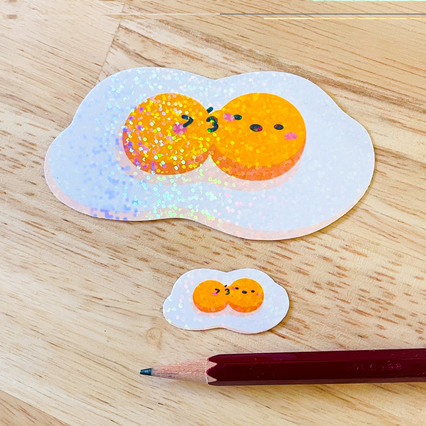 Fried Egg Double Kiss Stickers | Shiny holographic set of one large and one mini glitter sticker. Relationship status: It's complicated!