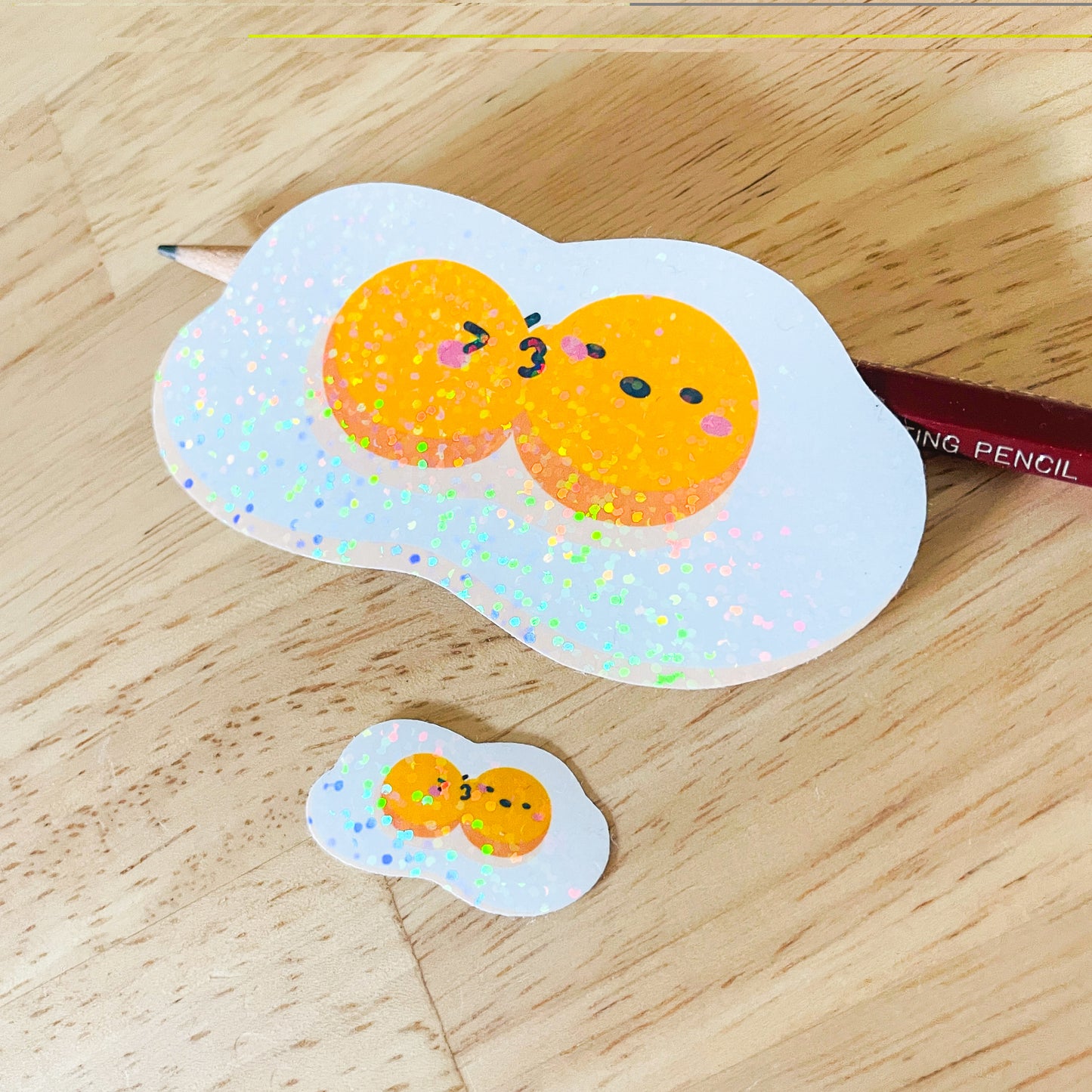 Fried Egg Double Kiss Stickers | Shiny holographic set of one large and one mini glitter sticker. Relationship status: It's complicated!