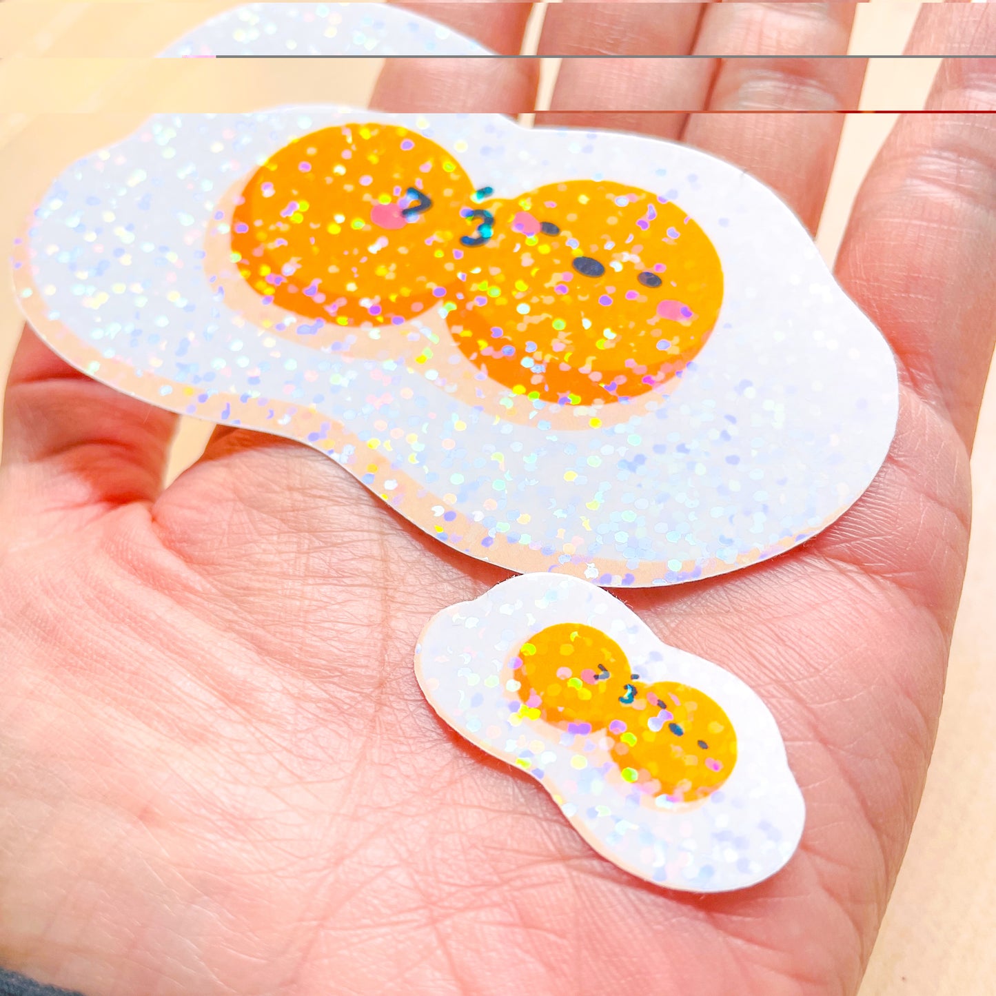 Fried Egg Double Kiss Stickers | Shiny holographic set of one large and one mini glitter sticker. Relationship status: It's complicated!